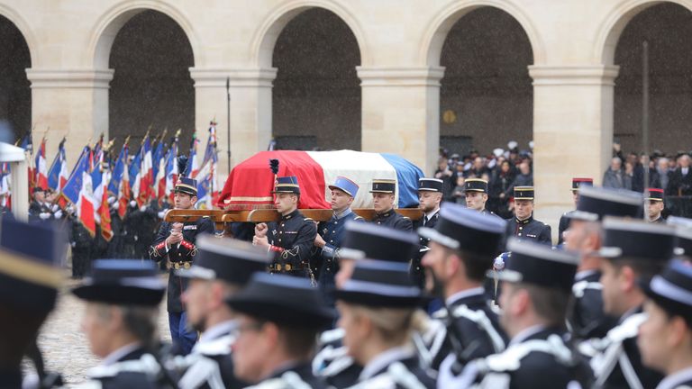 French Republican Guards and cadets carry the coffin of Lt Col Beltrame