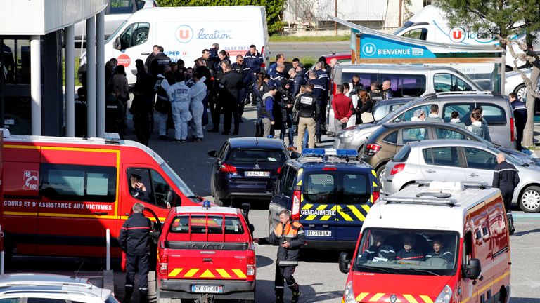 Rescue forces and police officers after the hostage situation in Trebes