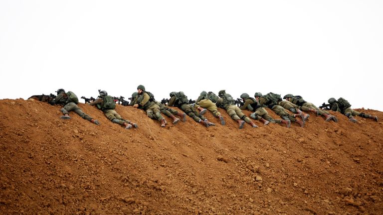 Israeli soldiers are seen near the Gaza border