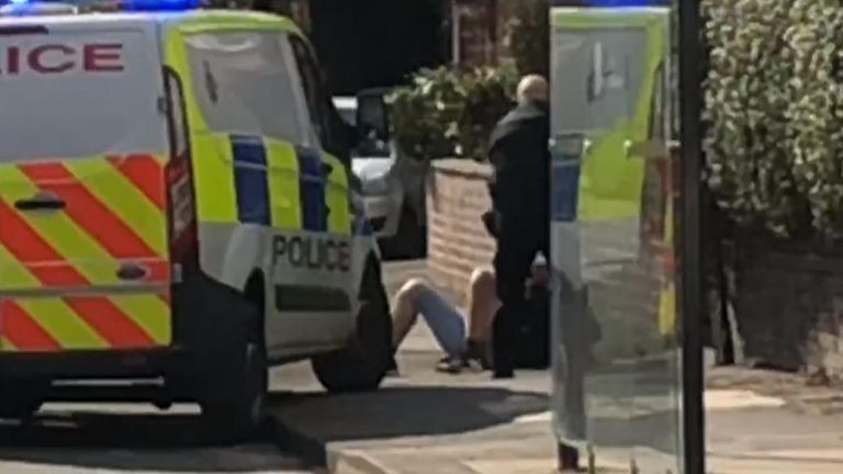 A man is arrested after attacking police with a sword in Manchester