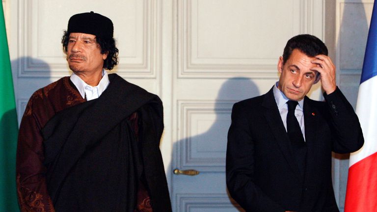 Nicolas Sarkozy and Muammar Gaddafi attend a ceremony for the signature of 10 billion euros of trade contracts between the two countries at the Elysee Palace in Paris, 2007