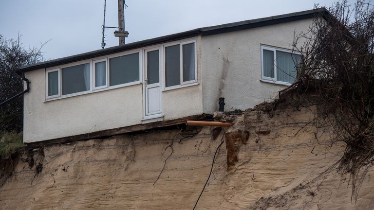 A house on Hemsby beach that has been evacuated after high winds and waves eroded the dunes on which it sits in Norfolk