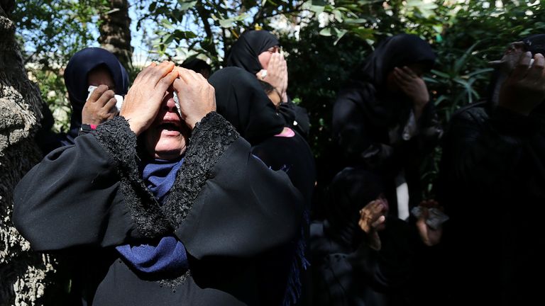 Relatives of a Palestinian farmer who was killed along Israel border with Gaza mourn