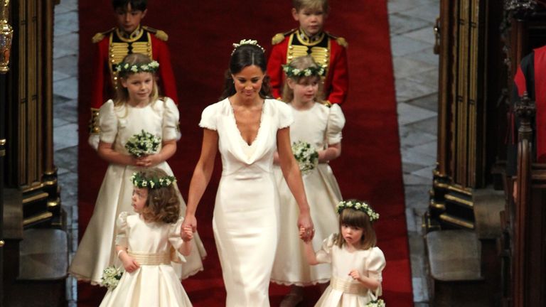 Maid of honour Pippa Middleton leads the flower girls and page boys down the aisle