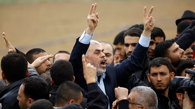 Islamist Hamas movement leader Yahya Sinwar (C) shouts slogans during the protest