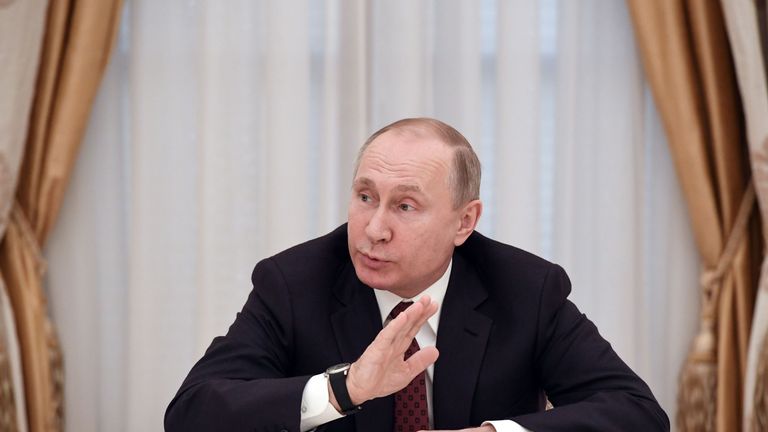 Russian President and presidential candidate Vladimir Putin meets with other candidates in the poll