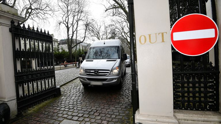 A bus carrying embassy staff and children leaves Russia&#39;s Embassy in London