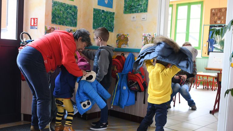Children arrive in a classroom at the Gavarnie-Gedre primary school, on March 16, 2018
