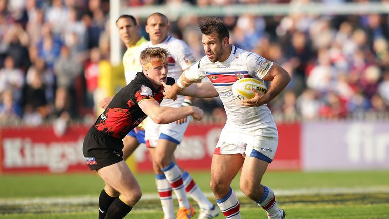 Scott Moore of Wakefield Wildcats holds off Adam OÕBrien of Bradford Bulls during the Million Pound Game between Wakefield Wildcats and Bradford Bulls at Belle Vue Stadium on October 3, 2015 in Wakefield, England. (Photo by Daniel Smith/Getty Images)