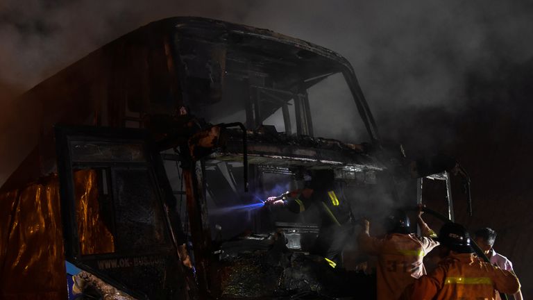 Firefighters putting the blaze out