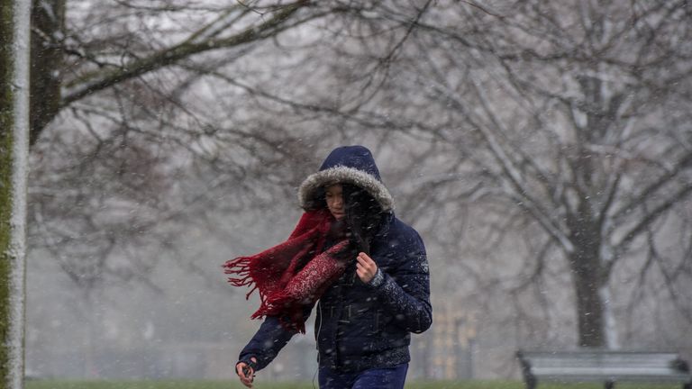LONDON, ENGLAND - MARCH 17: A woman walks through Kensington Gardens, Hyde Park as snow falls during a weather front that has been dubbed the mini beast from the east on March 17, 2018 in London, England. The Met Office has issued amber weather warnings for the South East of England and the Midlands as cold weather blows in from the east bringing snow, ice and temporary blizzard conditions. (Photo by Chris J Ratcliffe/Getty Images)