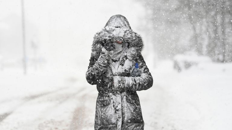 A woman makes her way through the snow in Balloch, Scotland