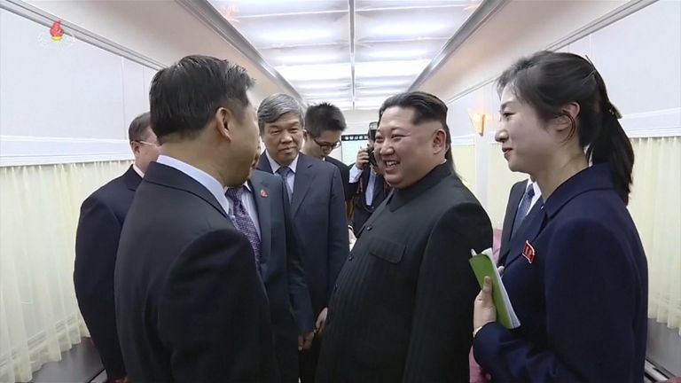 Mr Kim, with his assistant by his side, laughed as he spoke to Chinese politicians