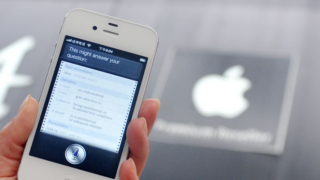 A woman displays 'Siri', voice-activated assistant technology, on an Apple iPhone 4S in Taipei on July 30, 2012. Taiwan's National Cheng Kung University has filed a suit against US tech giant Apple, claiming the company's Siri intelligent assistant has infringed on two of its patents. AFP PHOTO / Mandy CHENG (Photo credit should read Mandy Cheng/AFP/GettyImages)