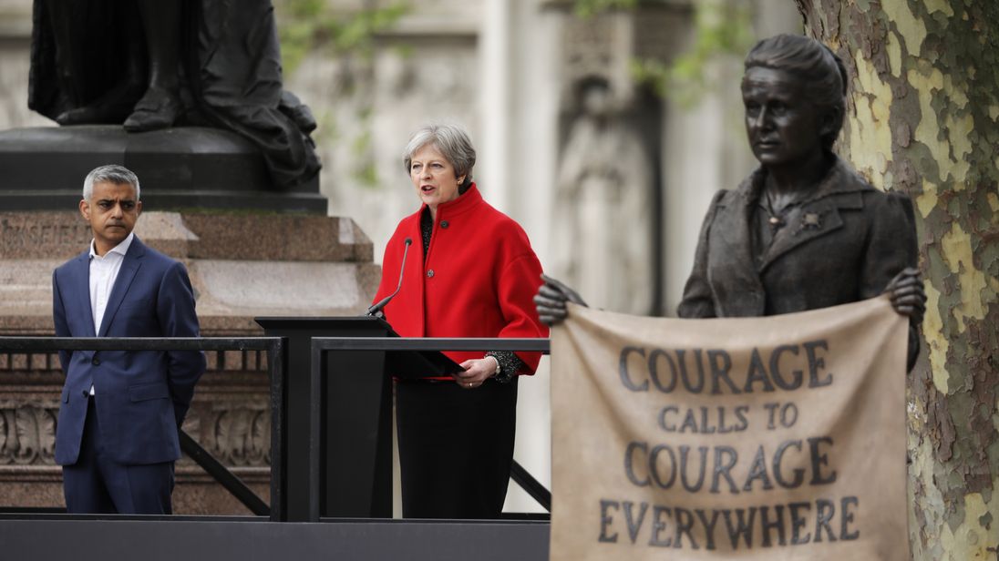 Theresa May gives a speech as Sadiq Khan looks on during the official unveiling of a statue in honour of the first female Suffragette Millicent Fawcett