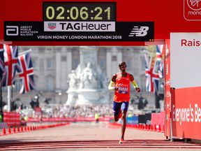 Mo Farah crosses the finish line