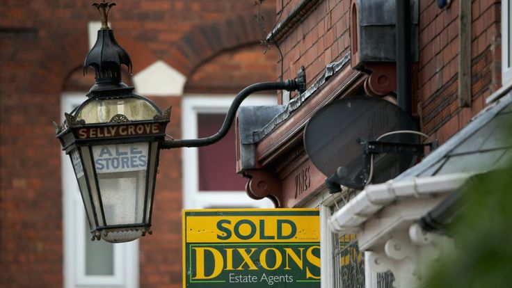 An array of For Sale signs protrude from houses in the Selly Oak area of Birmingham