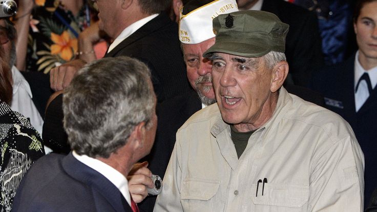 The US actor and Marine Corps veteran shakes hands with then president George W Bush in 2005