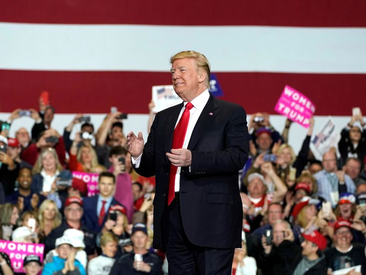 Donald Trump arrives to speak at a Make America Great Again Rally in Washington, Michigan