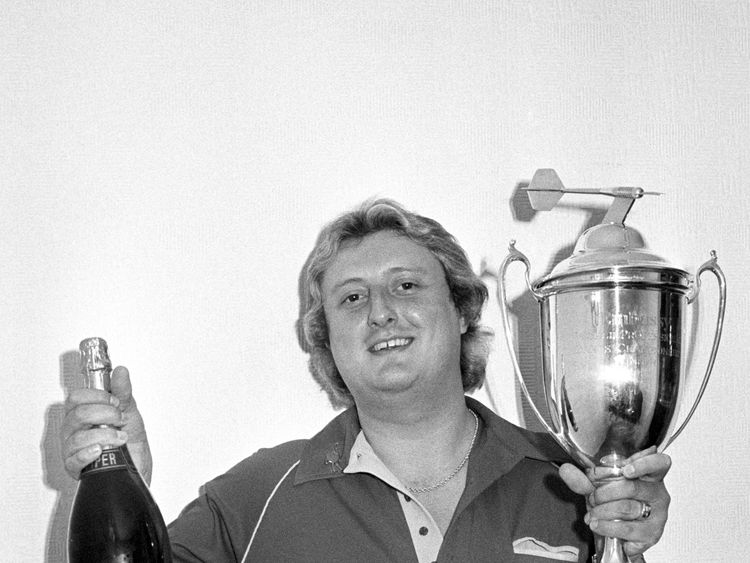 Eric Bristow with his world championship trophy in 1984
