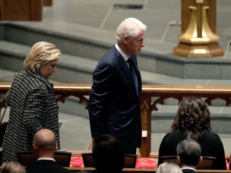Accompanied by his wife, Hillary Clinton,left, former President Bill Clinton arrives at St. Martin's Episcopal Church for a funeral service for former first lady Barbara Bush, Saturday, April 21, 2018, in Houston. (AP Photo/David J. Phillip )