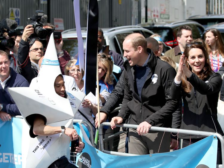 Catherine, Duchess of Cambridge, Prince William, Duke of Cambridge and Prince Harry hand out water to runners during the 2017 Virgin Money London Marathon on April 23, 2017 in London, England. The Duke and Duchess of Cambridge and Prince Harry, are spearheading Heads Together, in partnership with eight leading mental health charities, that are tackling stigma, raising awareness, and providing vital help for people with mental health problems.