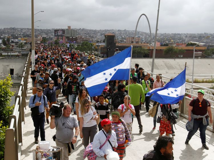 300 asylum seekers crossed the bridge in Tijuana to the US border 