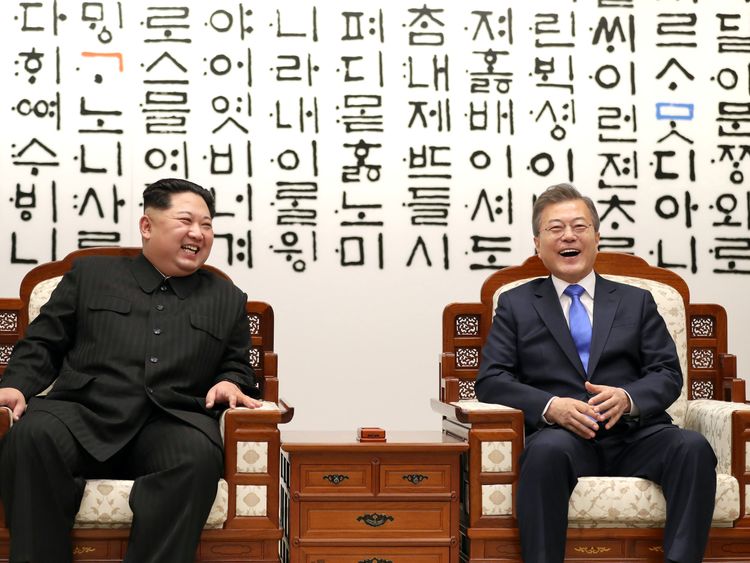 South Korean President Moon Jae-in talks with North Korean leader Kim Jong Un during their meeting at the Peace House