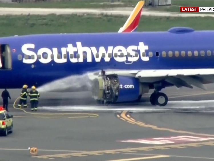 Firefighters attending the aircraft at Philadelphia International Airport
