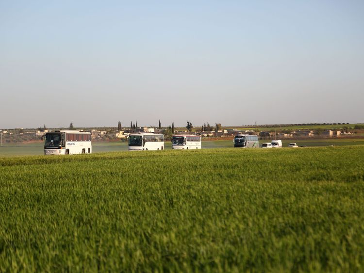 Buses carrying Jaish al Islam fighters from Douma arrive in the town of Azaz