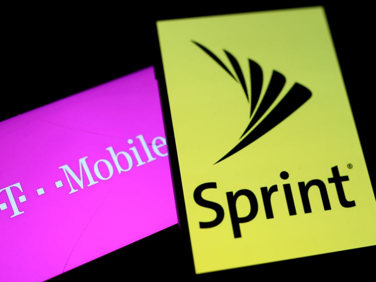 FILE PHOTO: Smartphones with the logos of T-Mobile and Sprint are seen in this illustration taken September 19, 2017