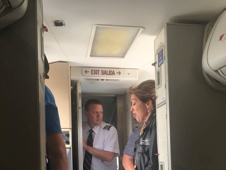 Pilot Tammie Jo Schults with members of the cabin crew on the plane in Philadelphia