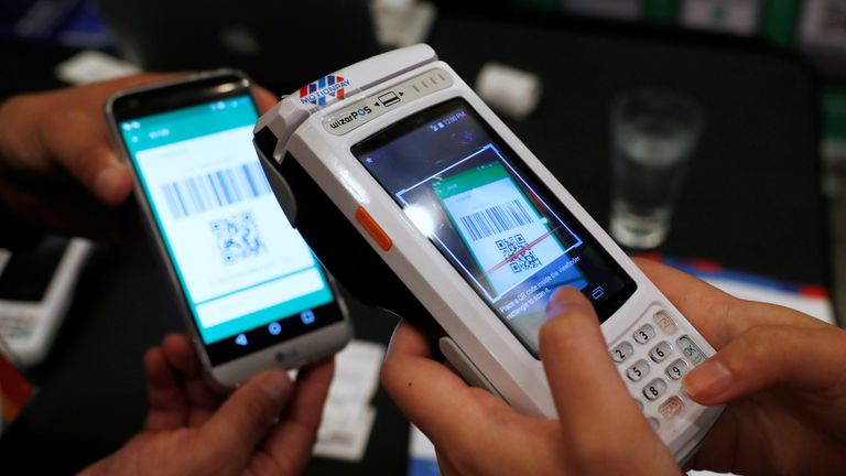 A device allowing customers to pay in Chinese yuan using WeChat Pay and Alipay using a QR code
