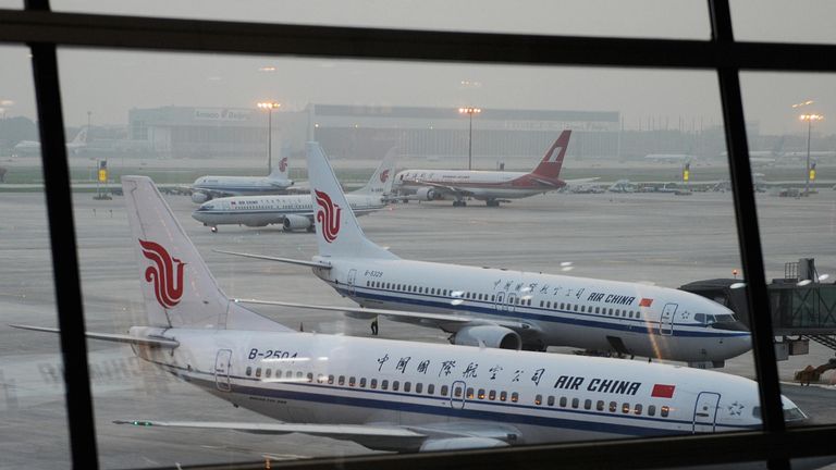 Aircrafts from Air China and Shanghai airlines wait to depart at the new International airport in Beijing on July 18, 2008