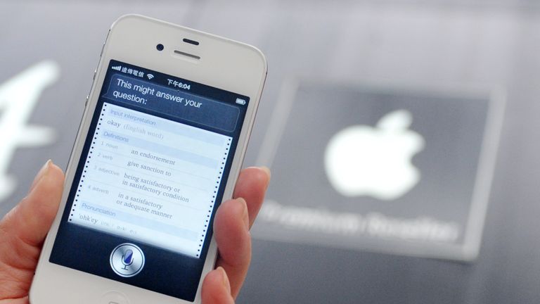 A woman displays &#39;Siri&#39;, voice-activated assistant technology, on an Apple iPhone 4S in Taipei on July 30, 2012. Taiwan&#39;s National Cheng Kung University has filed a suit against US tech giant Apple, claiming the company&#39;s Siri intelligent assistant has infringed on two of its patents. AFP PHOTO / Mandy CHENG (Photo credit should read Mandy Cheng/AFP/GettyImages)
