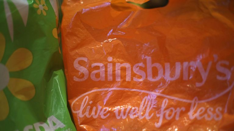File photo dated 28/04/18 of shopping bags from Asda and Sainsbury's, as the competition watchdog is being urged to investigate the possible merger of the two supermarket retailers amid concerns over consumer choice.