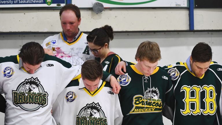Mourners embraced each other during a moment of prayer at the vigil