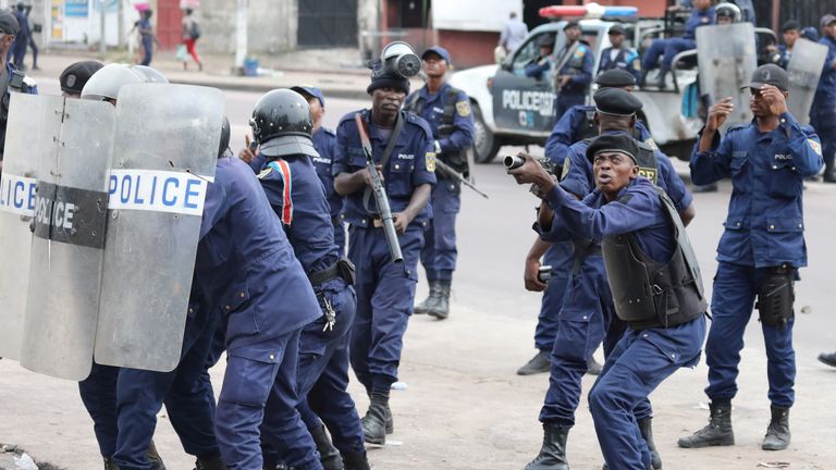 Police crack down on a protest in capital city Kinshasa