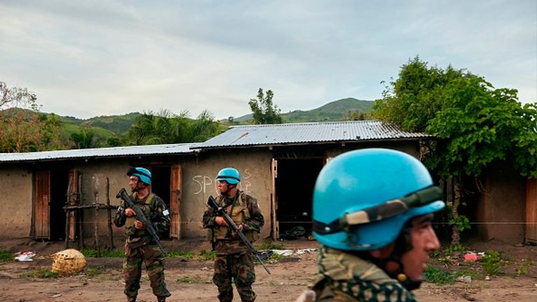 UN soldiers patrol the area surrounding the village of Kafe
