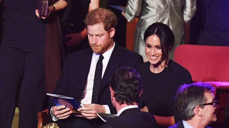 Harry and Meghan take their seats