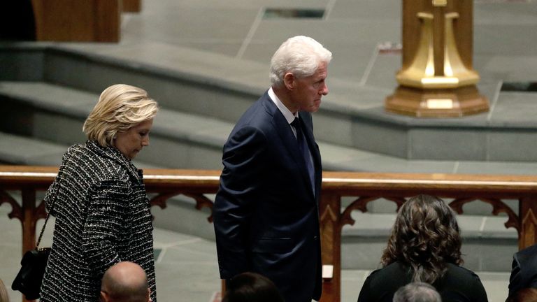 Accompanied by his wife, Hillary Clinton,left, former President Bill Clinton arrives at St. Martin's Episcopal Church for a funeral service for former first lady Barbara Bush, Saturday, April 21, 2018, in Houston. (AP Photo/David J. Phillip )