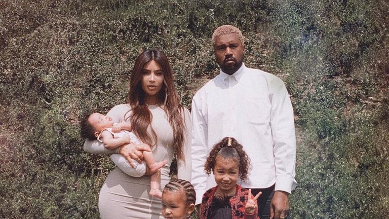 The family of five posed together 