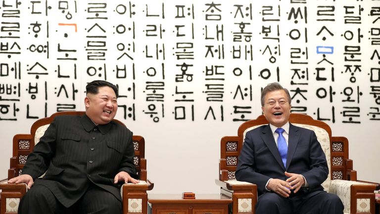 South Korean President Moon Jae-in talks with North Korean leader Kim Jong Un during their meeting at the Peace House