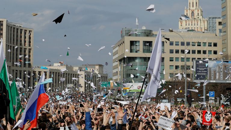 People release paper planes, symbol of the Telegram messenger,  in protest against a decision to block the messenger because it violated Russian regulations, in Moscow