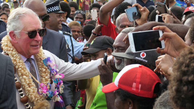 Prince Charles greets well-wishers as he walks along the seafront in Port Vila, Vanuatu, on April 7 2018