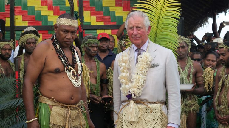 Prince Charles stands with Chief Seni Mao Tirsupe, the President of the Malvatumauri Council of Chiefs, at the Chiefs Nakamal in Port Vila, Vanuatu