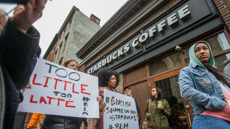 Protesters gather outside of a  Starbucks in Philadelphia where two black men were arrested