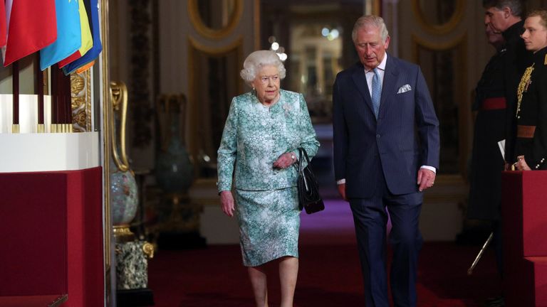 Queen Elizabeth and Prince Charles arrive for the formal opening of the Commonwealth Heads of Government Meeting 