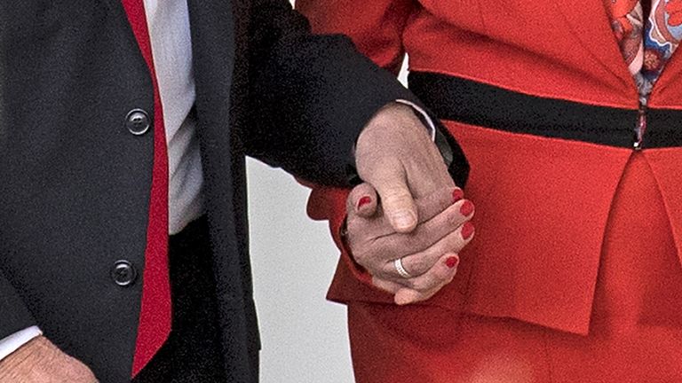 Who&#39;s hand is Mr Trump holding?