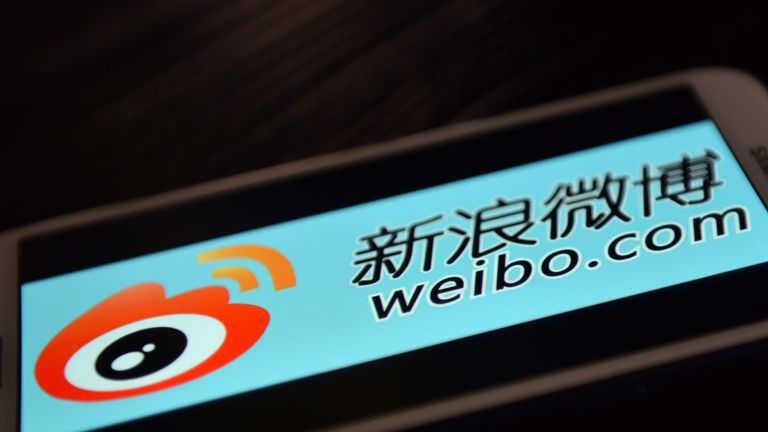 This photo illustration taken on March 19, 2014 shows the logo of Chinese microblogging platform Weibo on a smartphone in the Chinese financial city of Shanghai